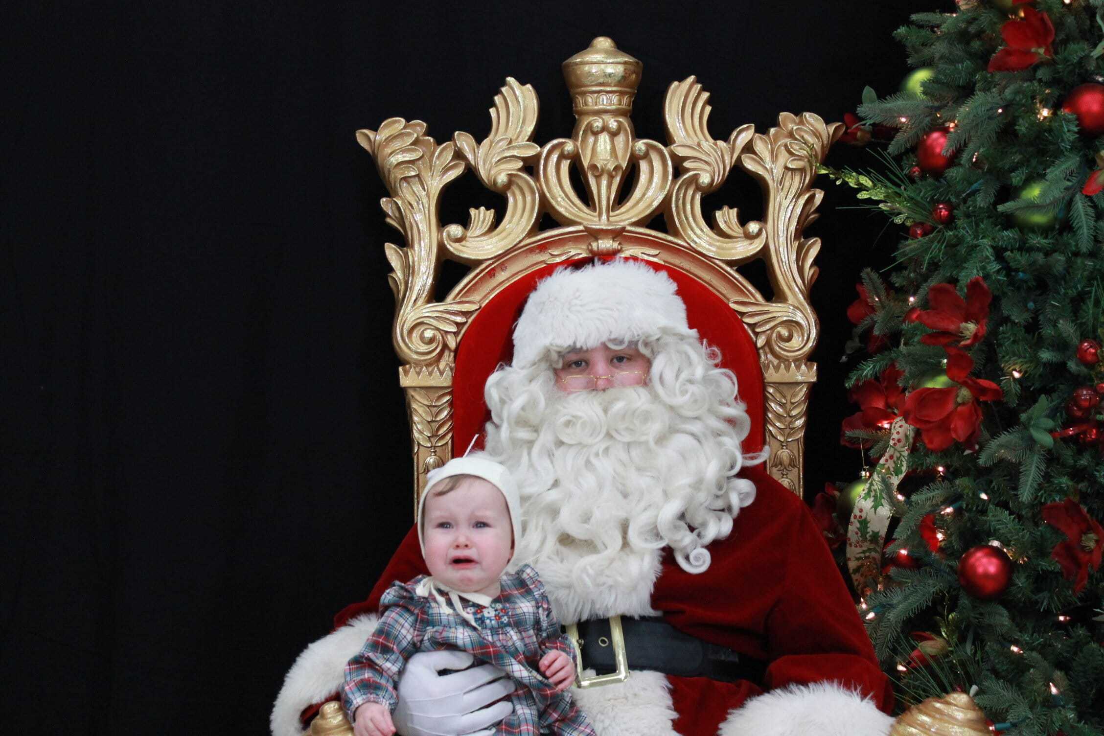 Baby crying on Santa's lap