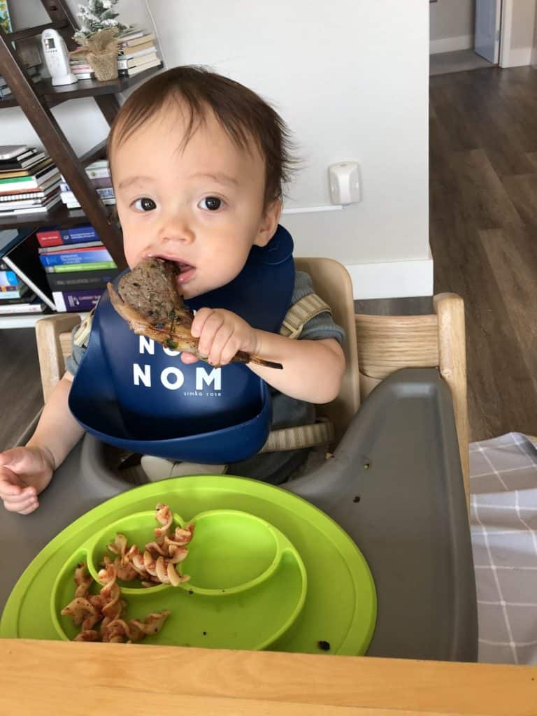 Child trying complementary foods with distinct taste and texture.