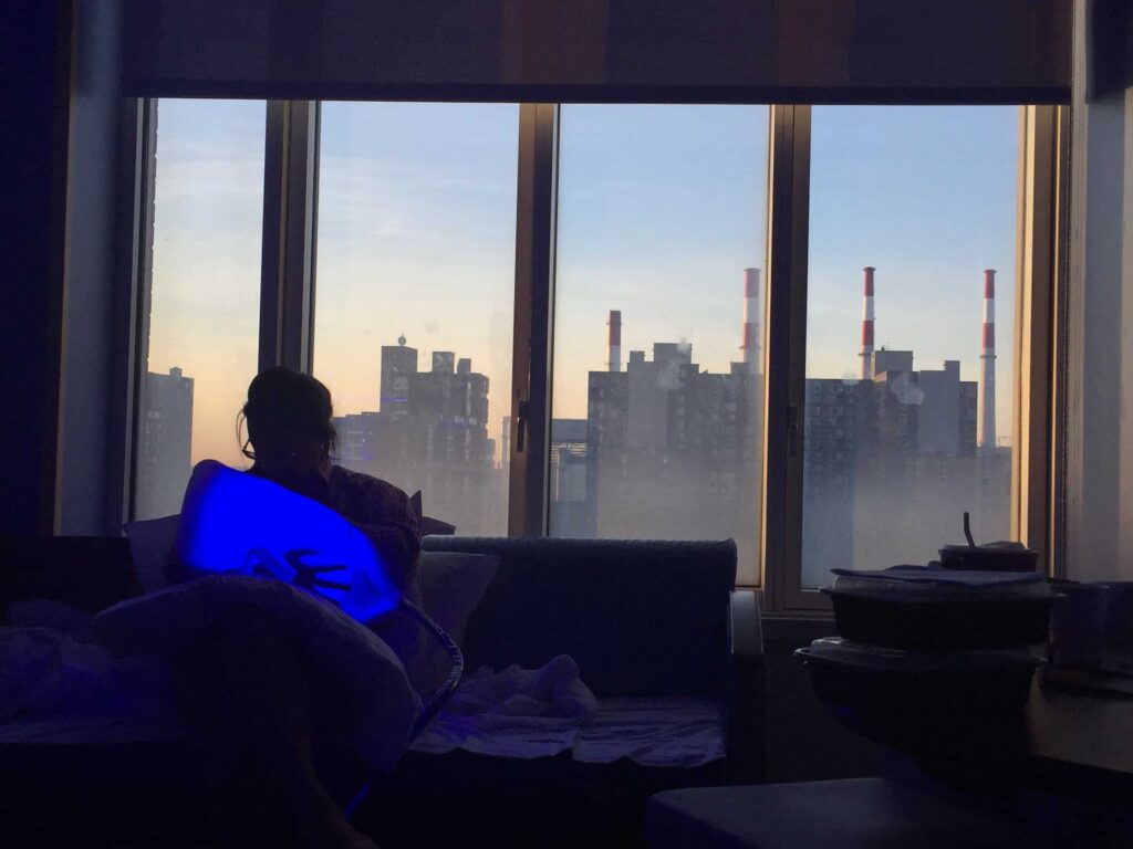 Baby in bilirubin light blanket with breastfeeding mom.