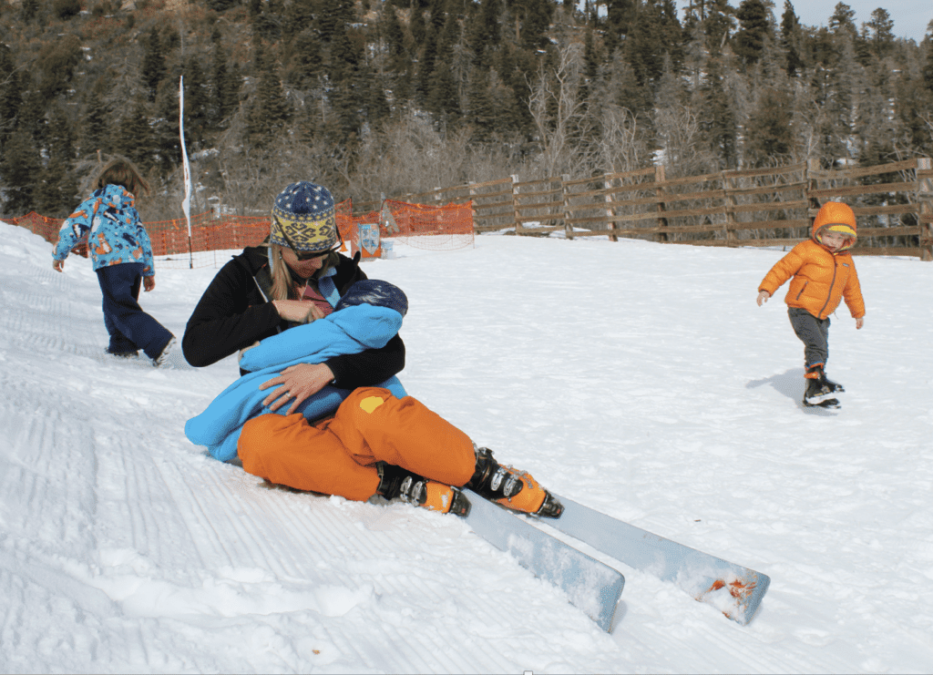 Mom breastfeeding while at a ski resort