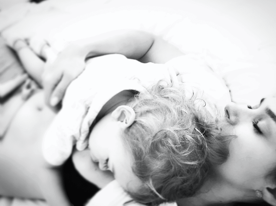 Baby and parent resting together