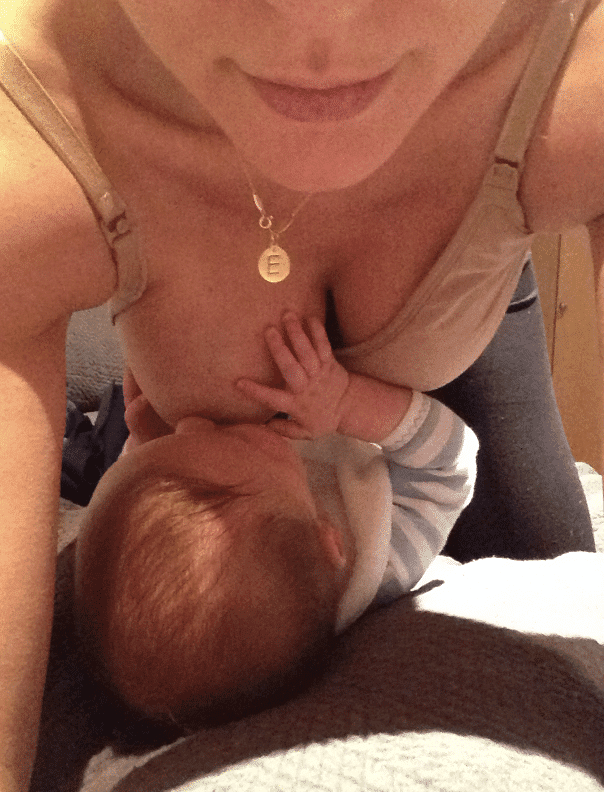 Baby is lying on the floor, breastfeeding while mom is kneeling on all fours. This may be a position to try just for fun, but it’s not going to help a “plug”!