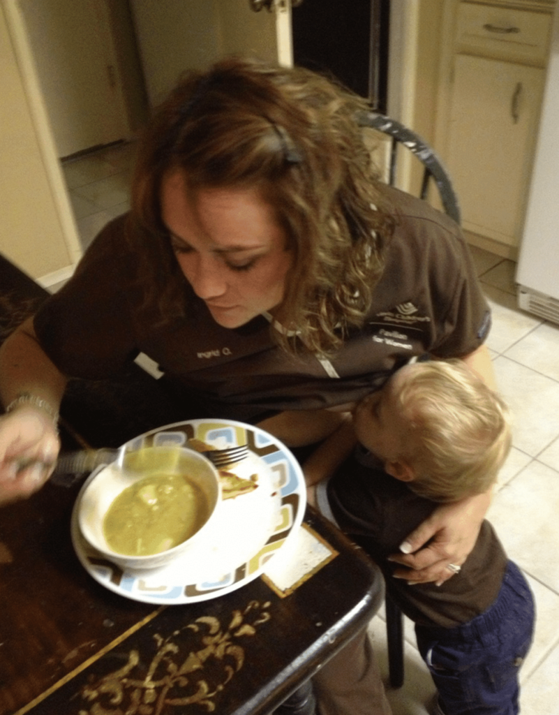 Mother eating while child is breastfeeding