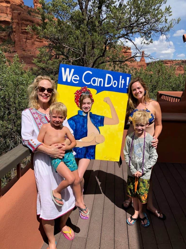 Dr. Mitchell and Friends and family with the We Can Do It Breastfeeding poster