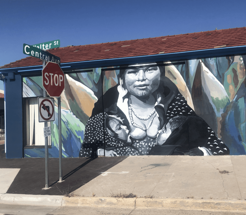 painted mural of woman tandem breastfeeding