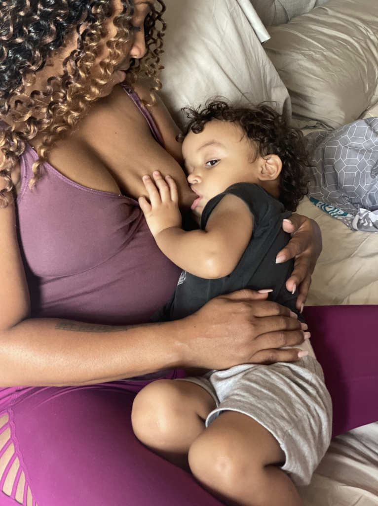 mom breastfeeding older baby