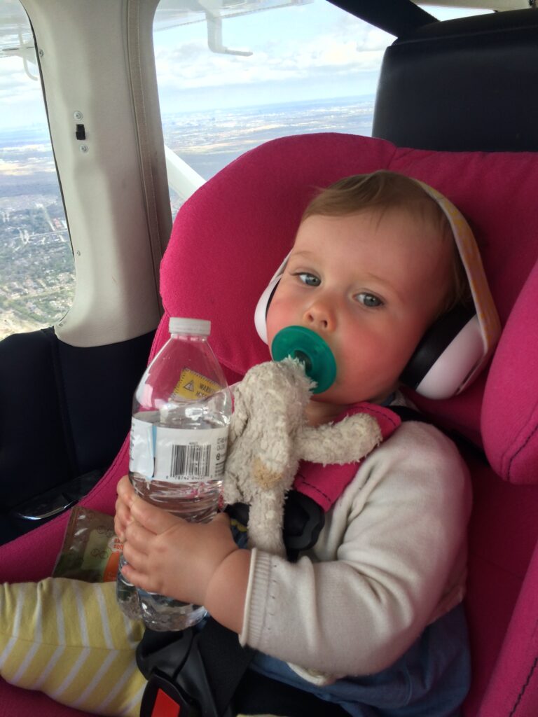 Child with pacifier and water bottle