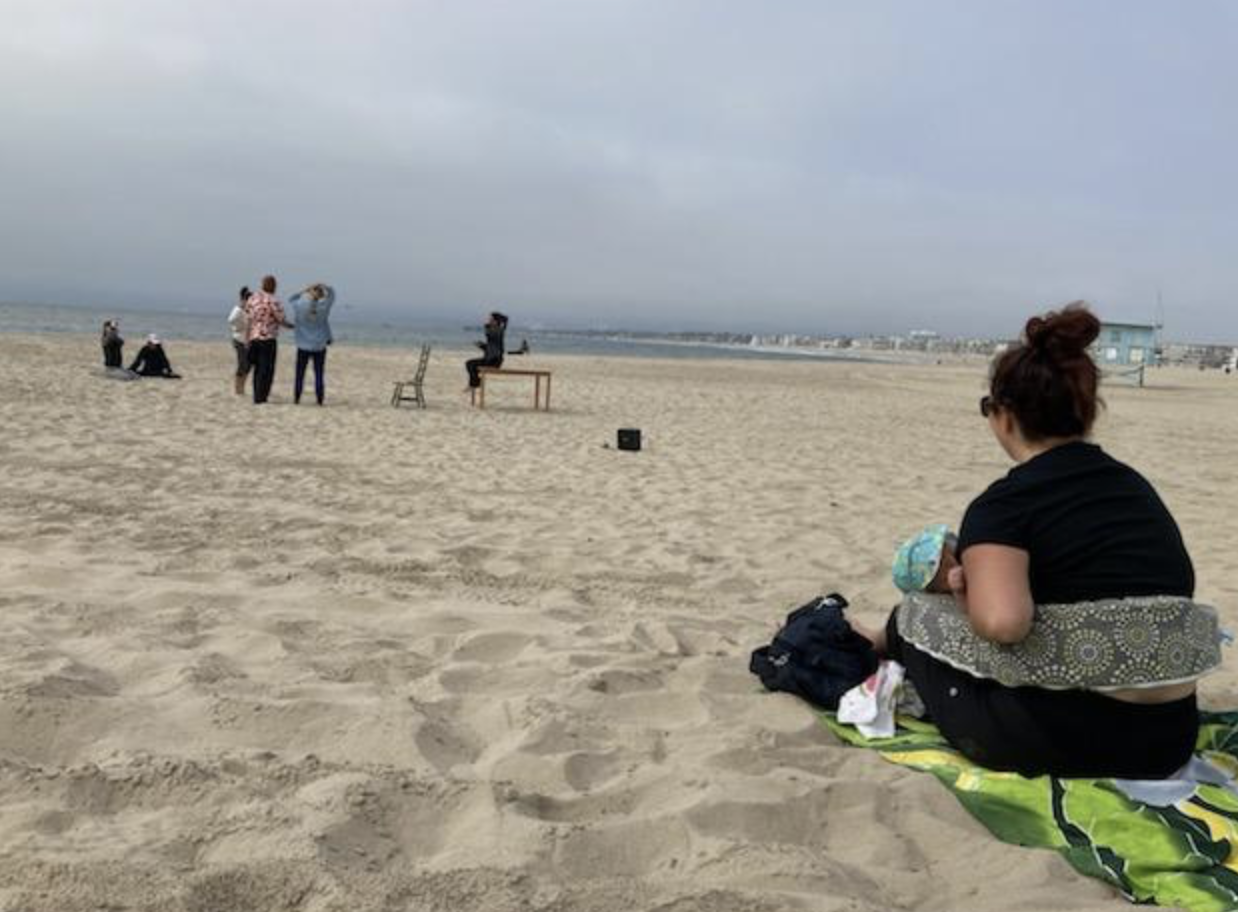 mom nursing at beach
